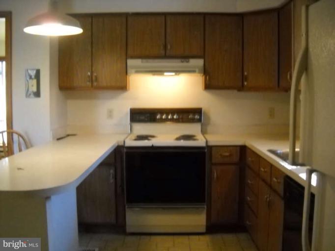 106 Birch Run Road Chestertown, MD 21620 - Photo 17 of 25 a kitchen with a stove and a refrigerator