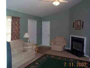 208 Geranium Road Ruckersville, VA 22968 - Photo 2 of 4 a living room with furniture and a fireplace