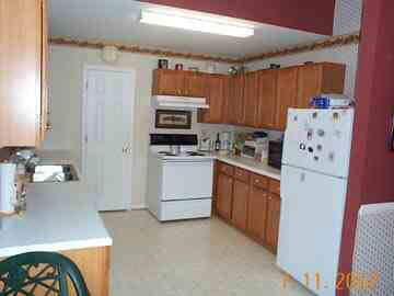 208 Geranium Road Ruckersville, VA 22968 - Photo 3 of 4 a kitchen with a refrigerator sink and stove
