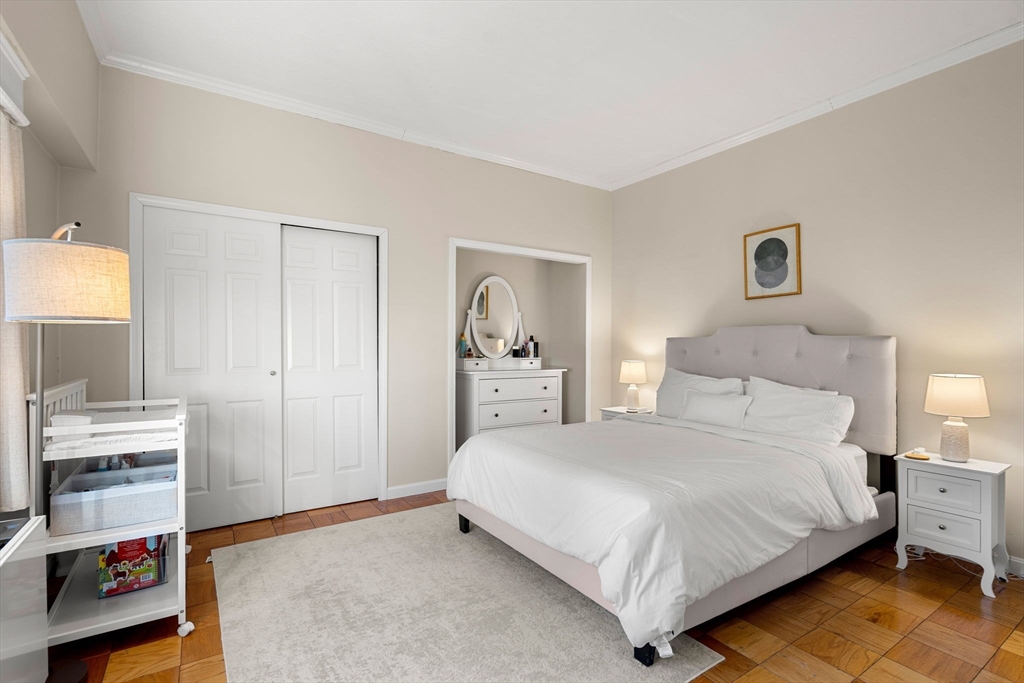 2 Hawthorne Place, Unit 17M Boston, MA 02114 - Photo 21 of 33 a bedroom with a bed and a tv