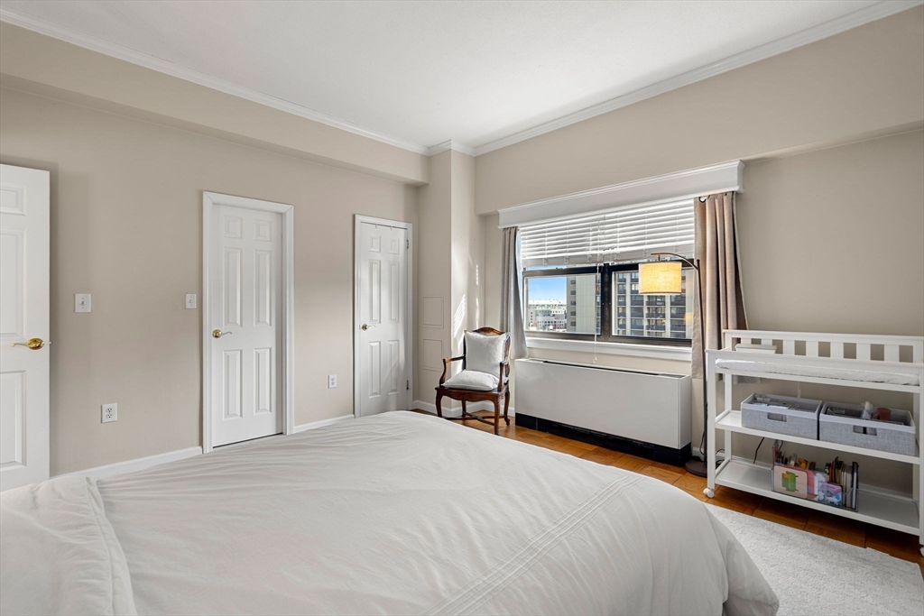 2 Hawthorne Place, Unit 17M Boston, MA 02114 - Photo 22 of 33 a bedroom with a bed and a large window