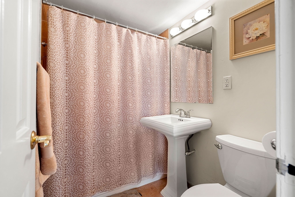 2 Hawthorne Place, Unit 17M Boston, MA 02114 - Photo 25 of 33 a bathroom with a sink toilet and mirror