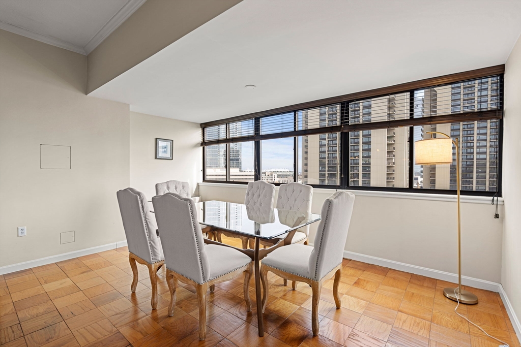 2 Hawthorne Place, Unit 17M Boston, MA 02114 - Photo 6 of 33 a dining room with furniture and window
