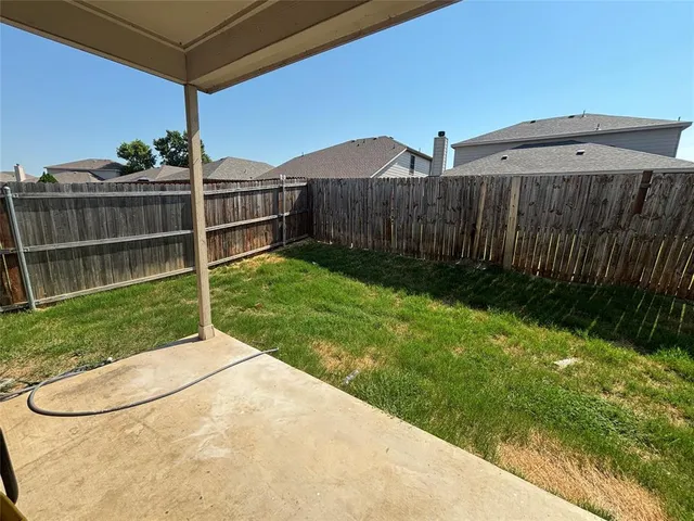 a view of a backyard with pathway