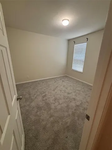 a view of a hallway with the wooden floor