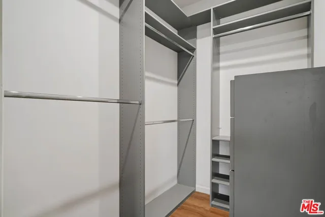 a view of closet area with stairs