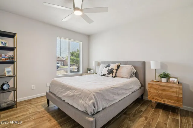 a bedroom with a bed and a window