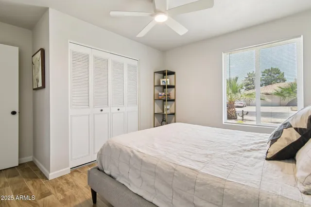 a bedroom with a large bed and a window