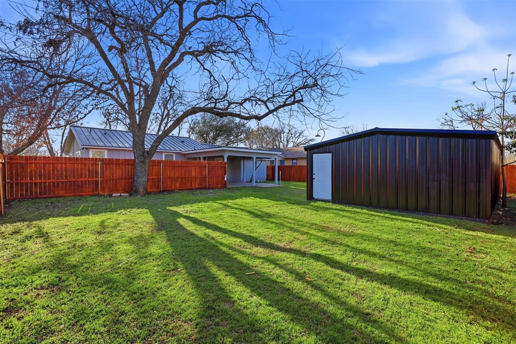 502 Madison Street Cleburne, TX 76033 - Photo 25 of 30 a house view with a garden space