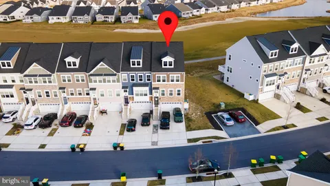 a view of a swimming pool with a table and chairs