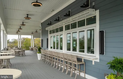 a view of a chairs and table in patio