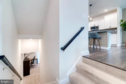 a living room with fireplace furniture and a flat screen tv