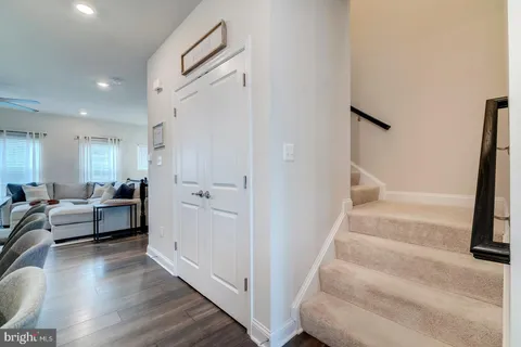 a view of a livingroom with furniture and stairs