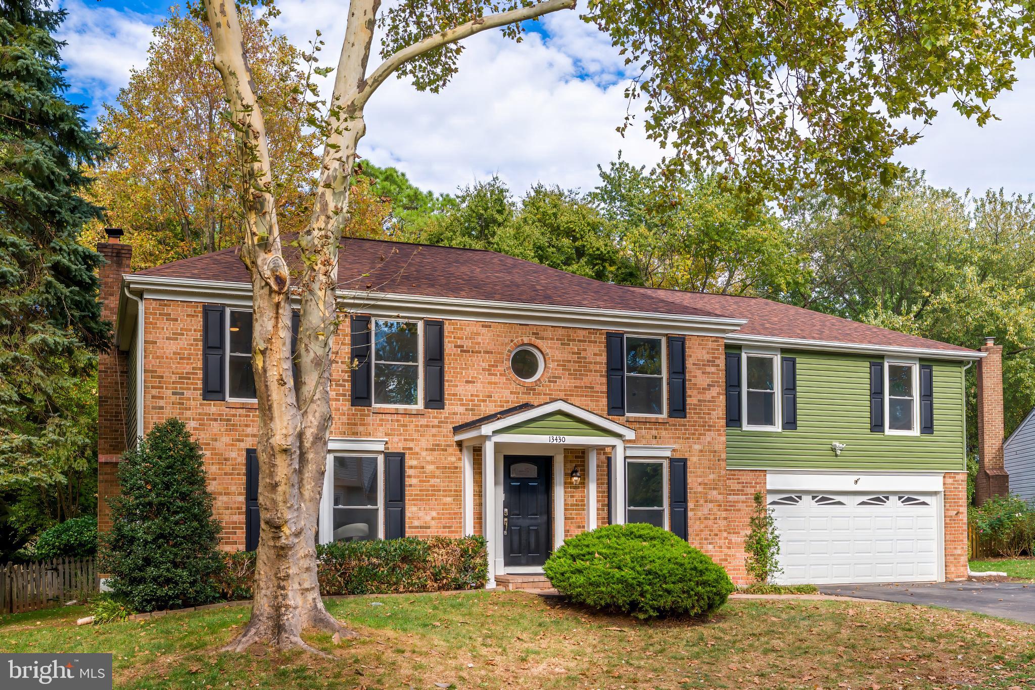 13430 Hidden Meadow Court Herndon, VA 20171 - Photo 2 of 54 a front view of a house with a yard