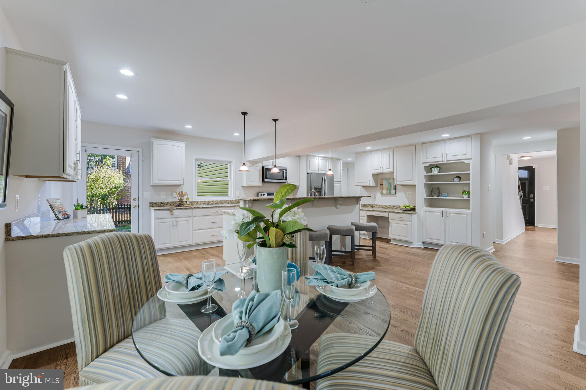 13430 Hidden Meadow Court Herndon, VA 20171 - Photo 22 of 54 a living room with furniture kitchen view and a large window