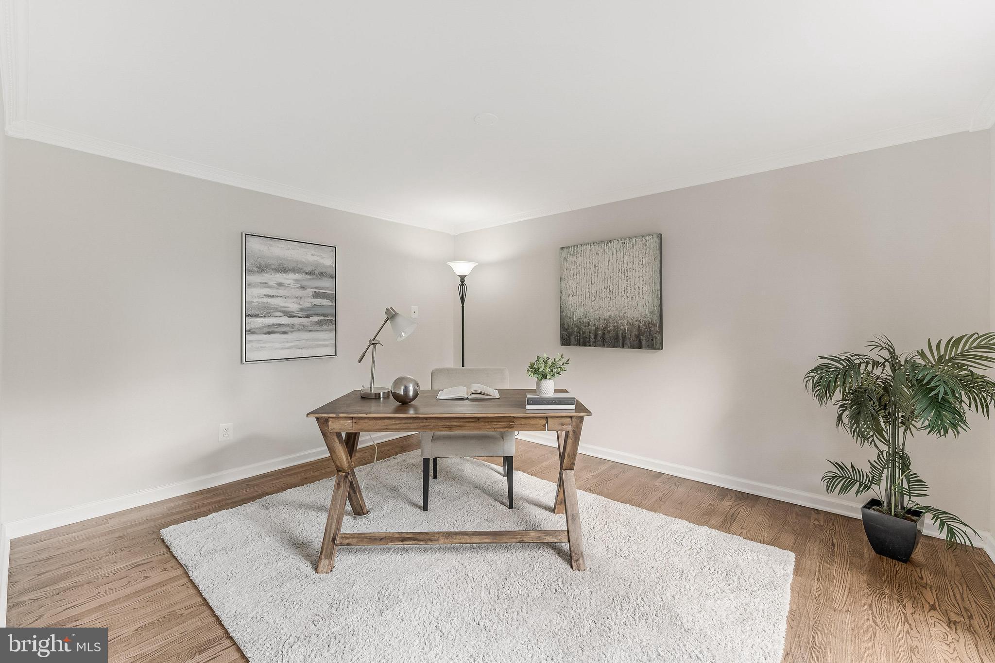 13430 Hidden Meadow Court Herndon, VA 20171 - Photo 3 of 54 a view of a work space with furniture and wooden floor