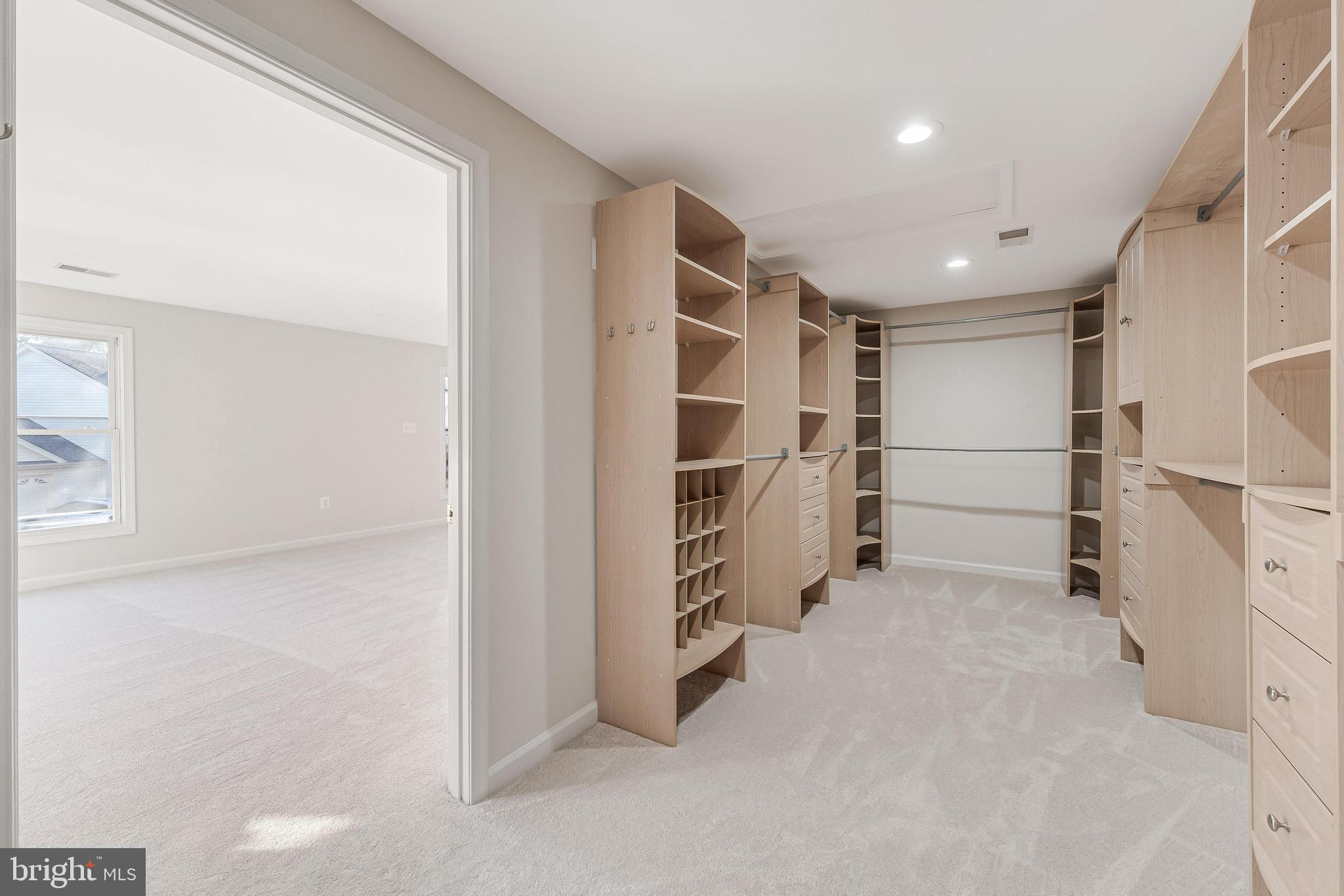 13430 Hidden Meadow Court Herndon, VA 20171 - Photo 31 of 54 a view of walk in closet with empty racks