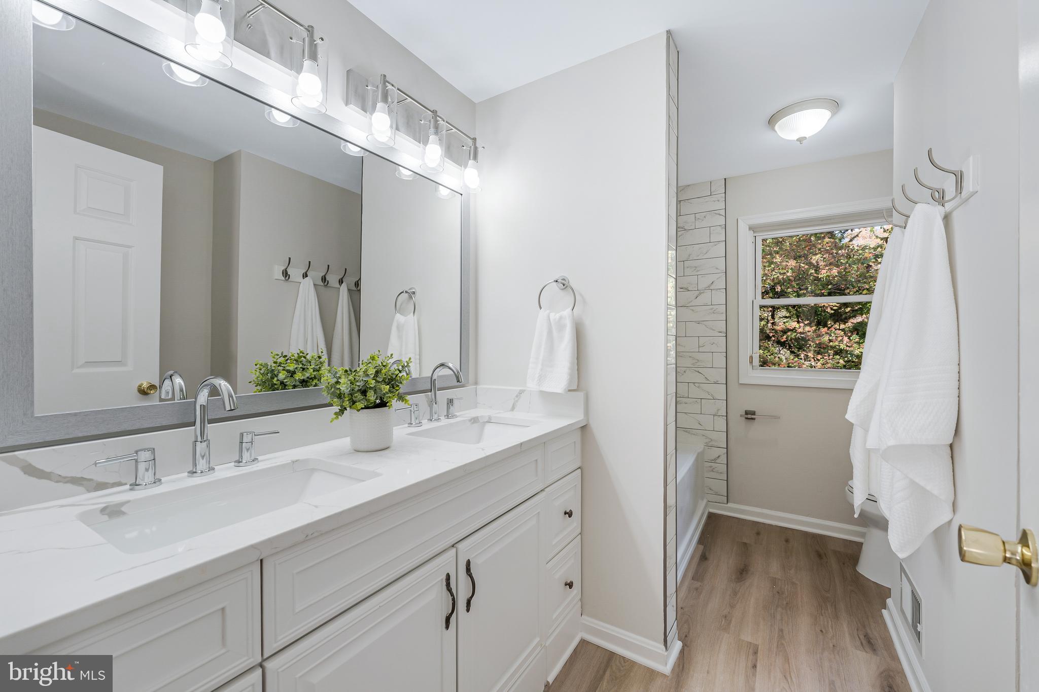13430 Hidden Meadow Court Herndon, VA 20171 - Photo 42 of 54 a bathroom with a sink and a mirror