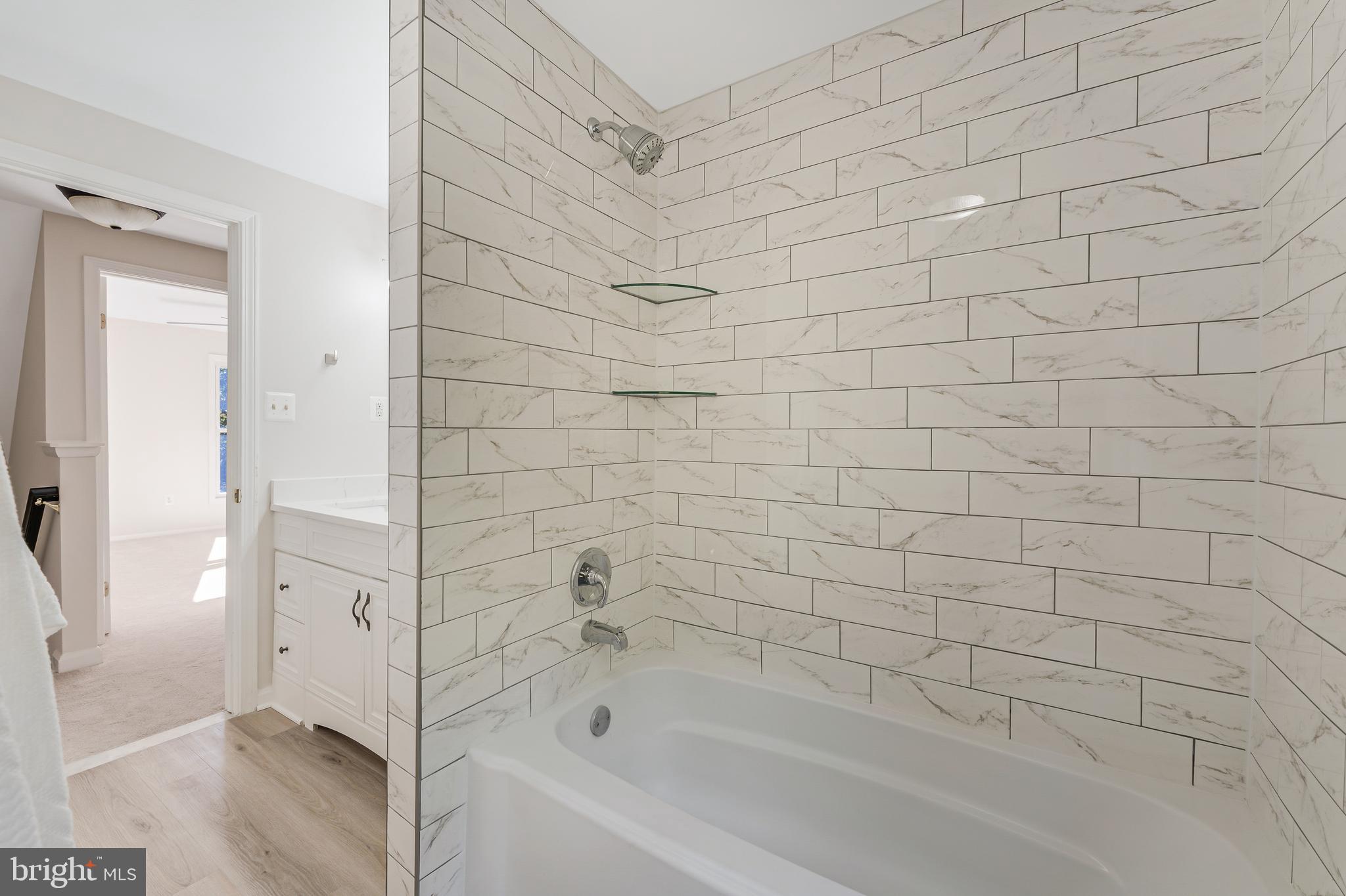 13430 Hidden Meadow Court Herndon, VA 20171 - Photo 43 of 54 a bathroom with a bathtub