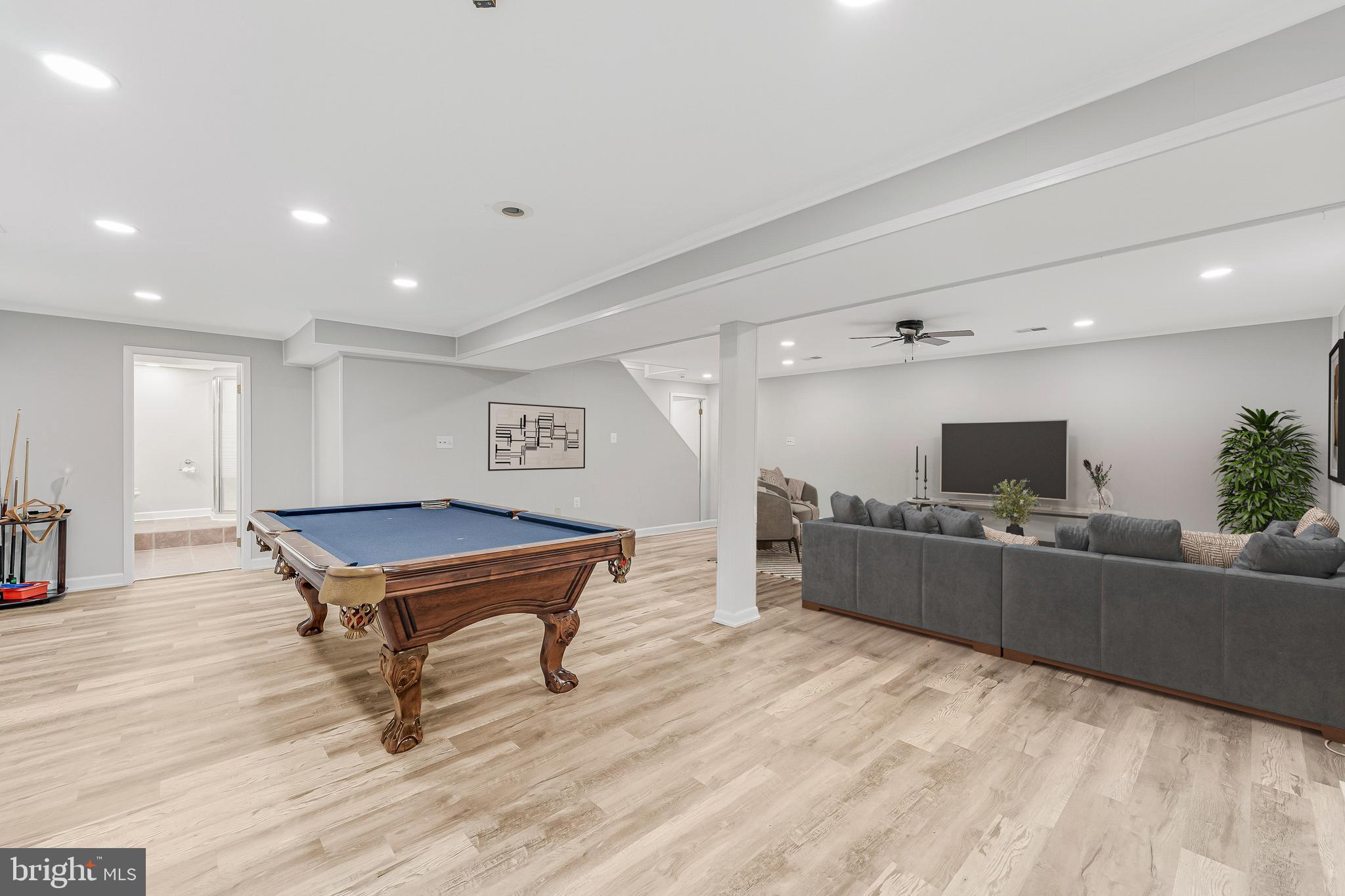 13430 Hidden Meadow Court Herndon, VA 20171 - Photo 45 of 54 a living room with furniture and a flat screen tv