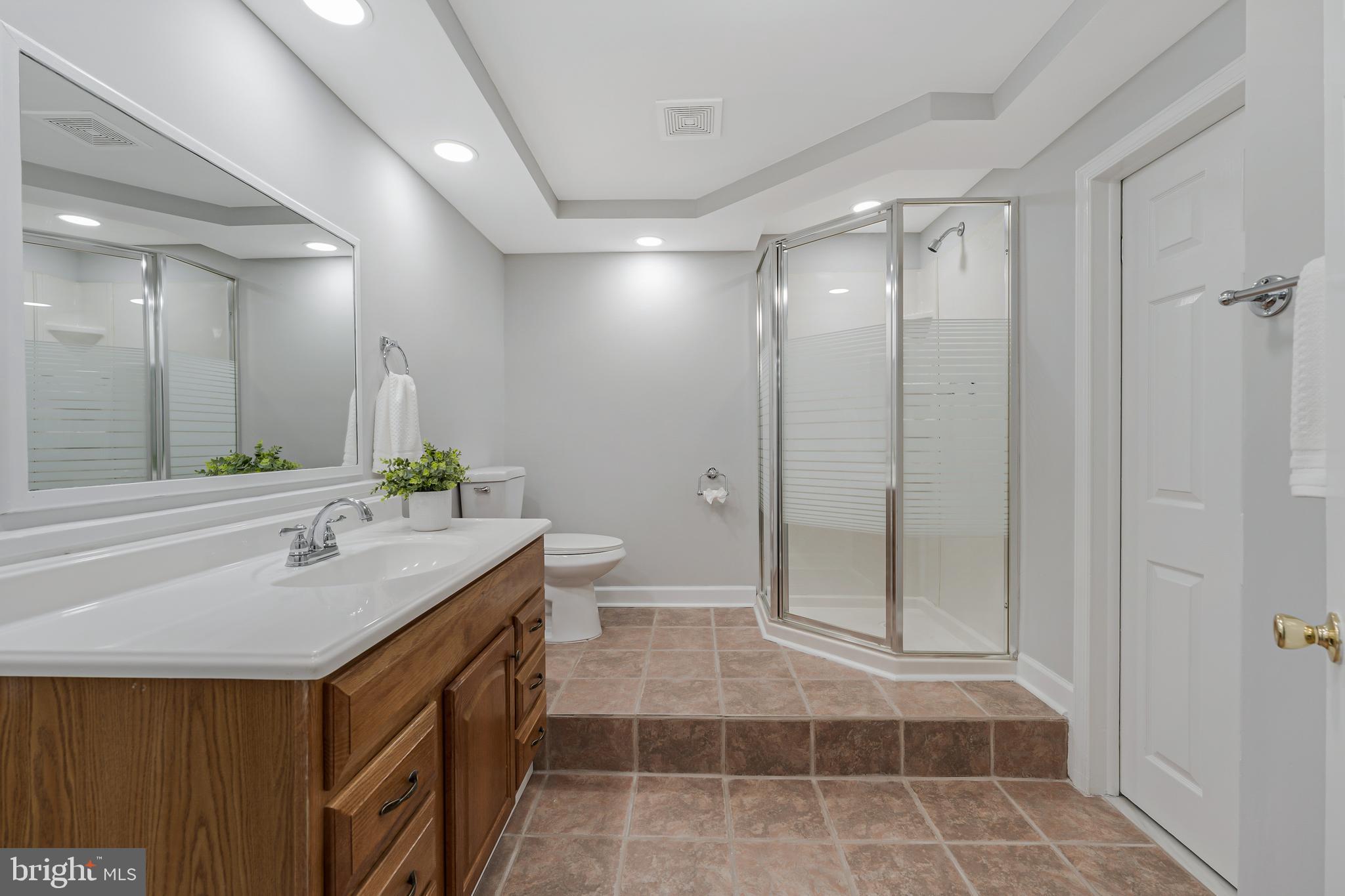 13430 Hidden Meadow Court Herndon, VA 20171 - Photo 47 of 54 a bathroom with a double vanity sink and a mirror