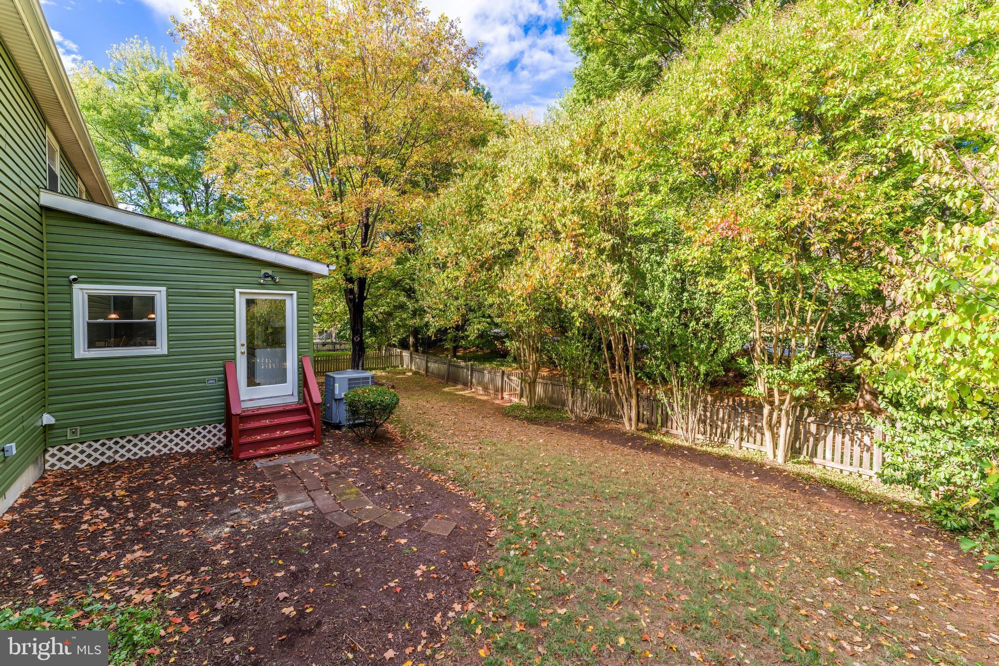 13430 Hidden Meadow Court Herndon, VA 20171 - Photo 49 of 54 a view of a house with backyard and sitting area