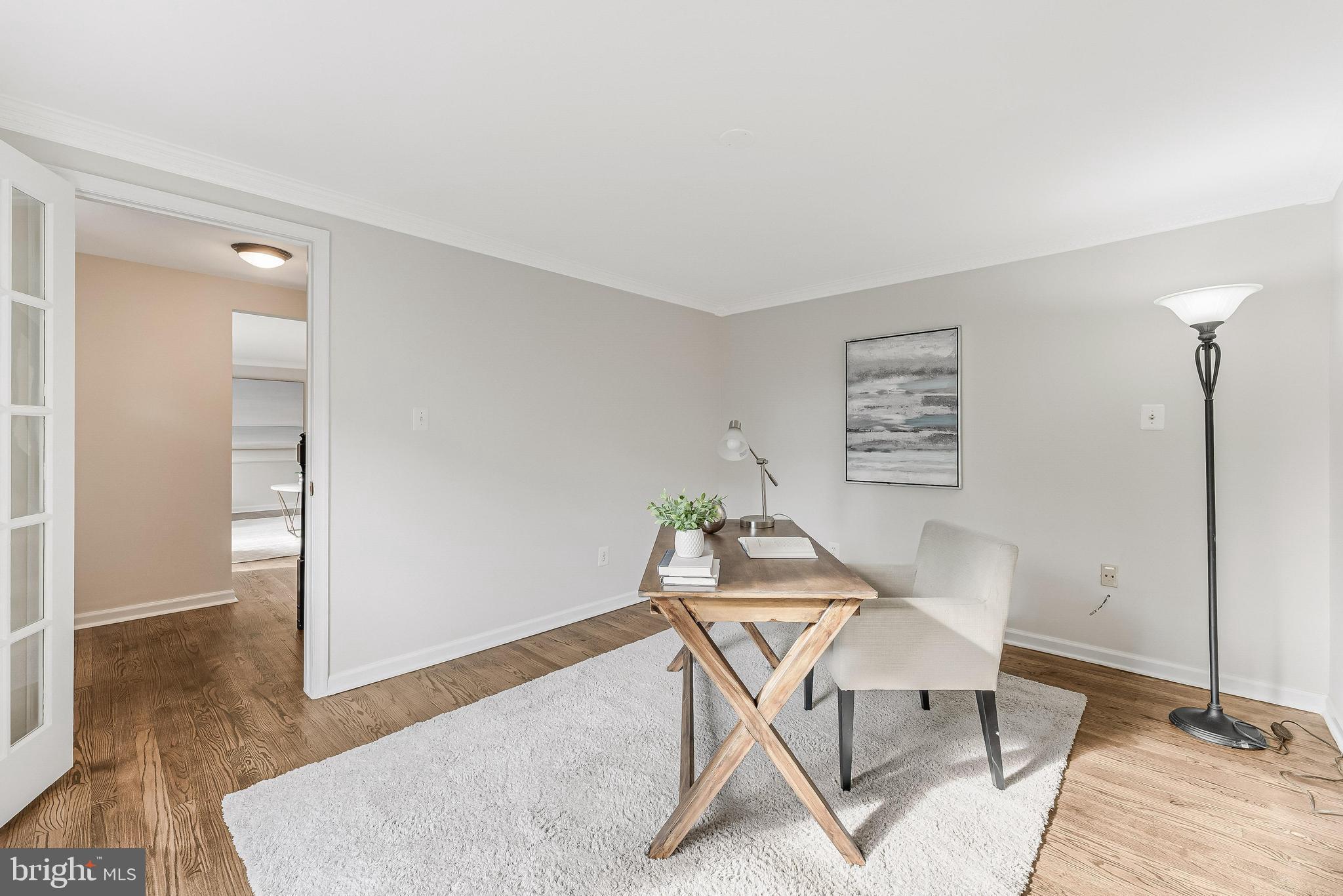 13430 Hidden Meadow Court Herndon, VA 20171 - Photo 5 of 54 a workspace with furniture and a wooden floor