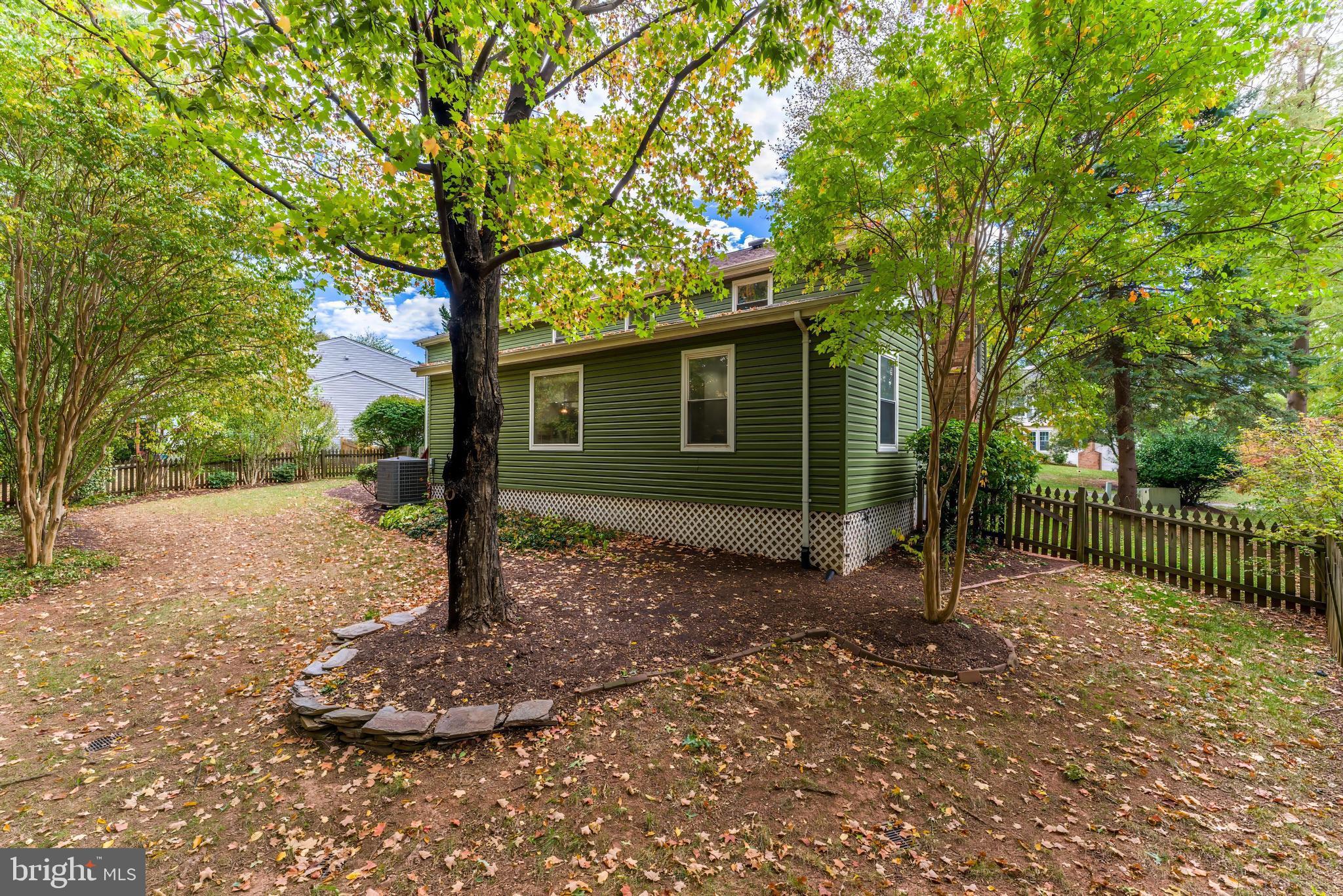13430 Hidden Meadow Court Herndon, VA 20171 - Photo 51 of 54 a house with trees in front of it