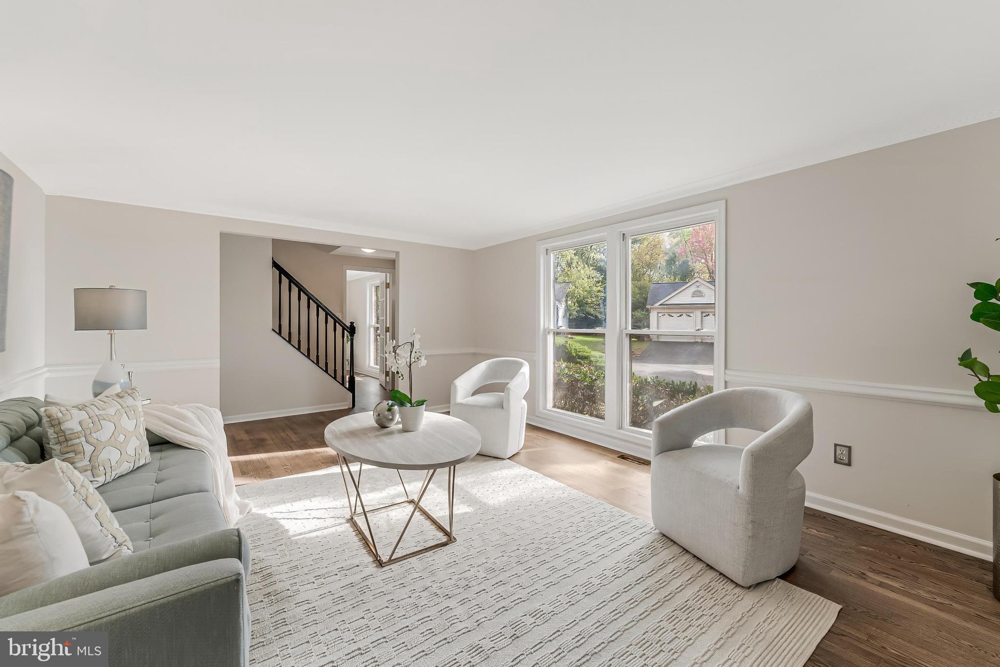 13430 Hidden Meadow Court Herndon, VA 20171 - Photo 8 of 54 a living room with furniture and a window