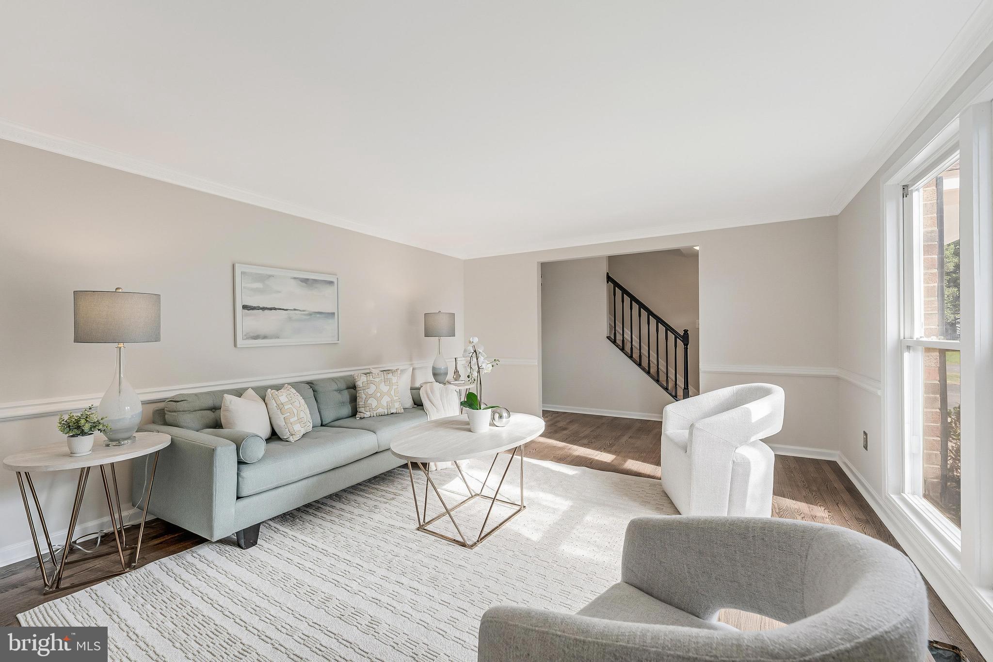 13430 Hidden Meadow Court Herndon, VA 20171 - Photo 9 of 54 a living room with furniture and a large window
