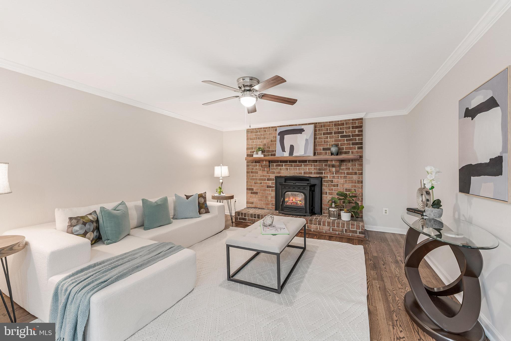 13430 Hidden Meadow Court Herndon, VA 20171 - Photo 10 of 54 a living room with furniture and a fireplace