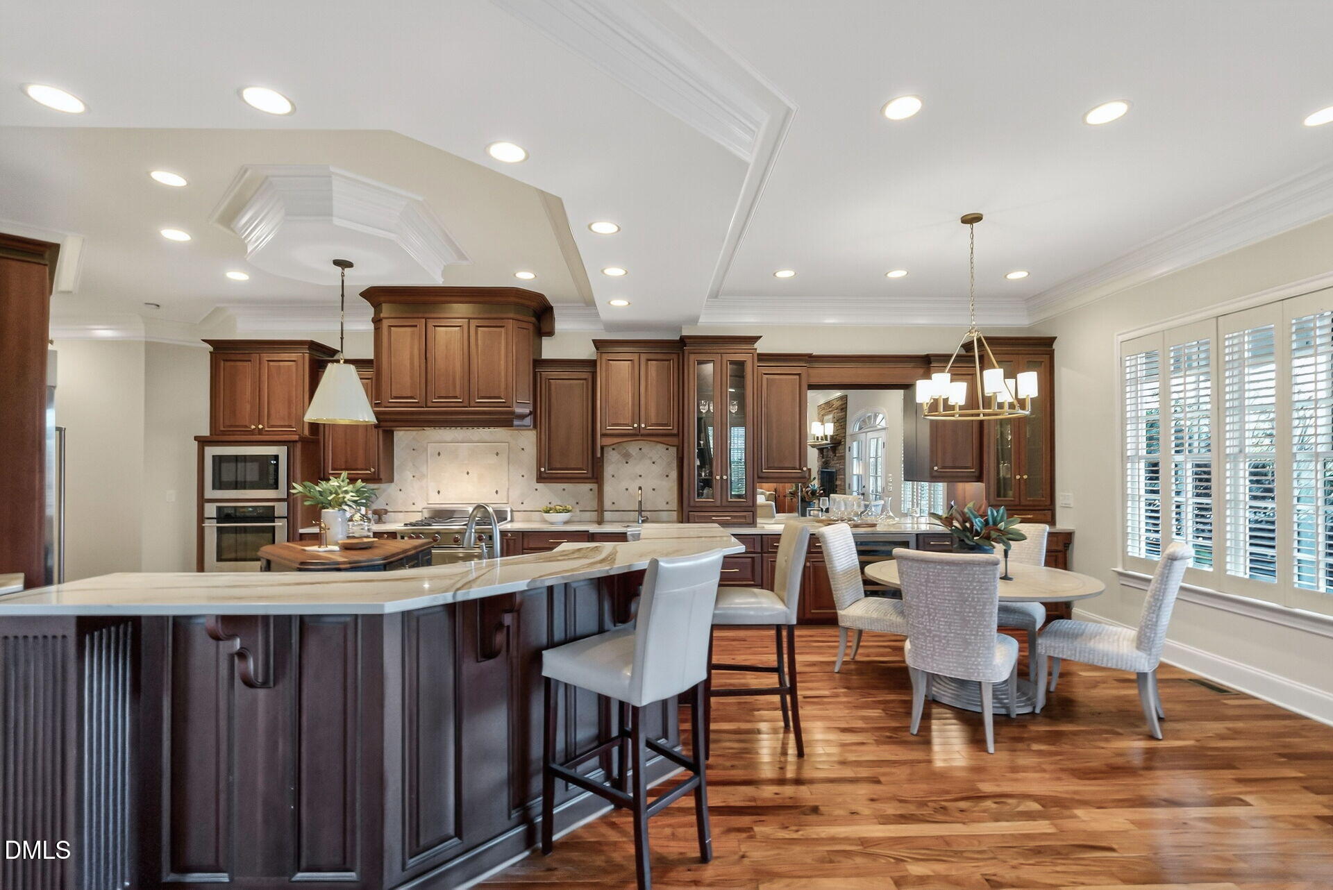 4119 English Garden Way Raleigh, NC 27612 - Photo 16 of 48 a large kitchen with a table and chairs