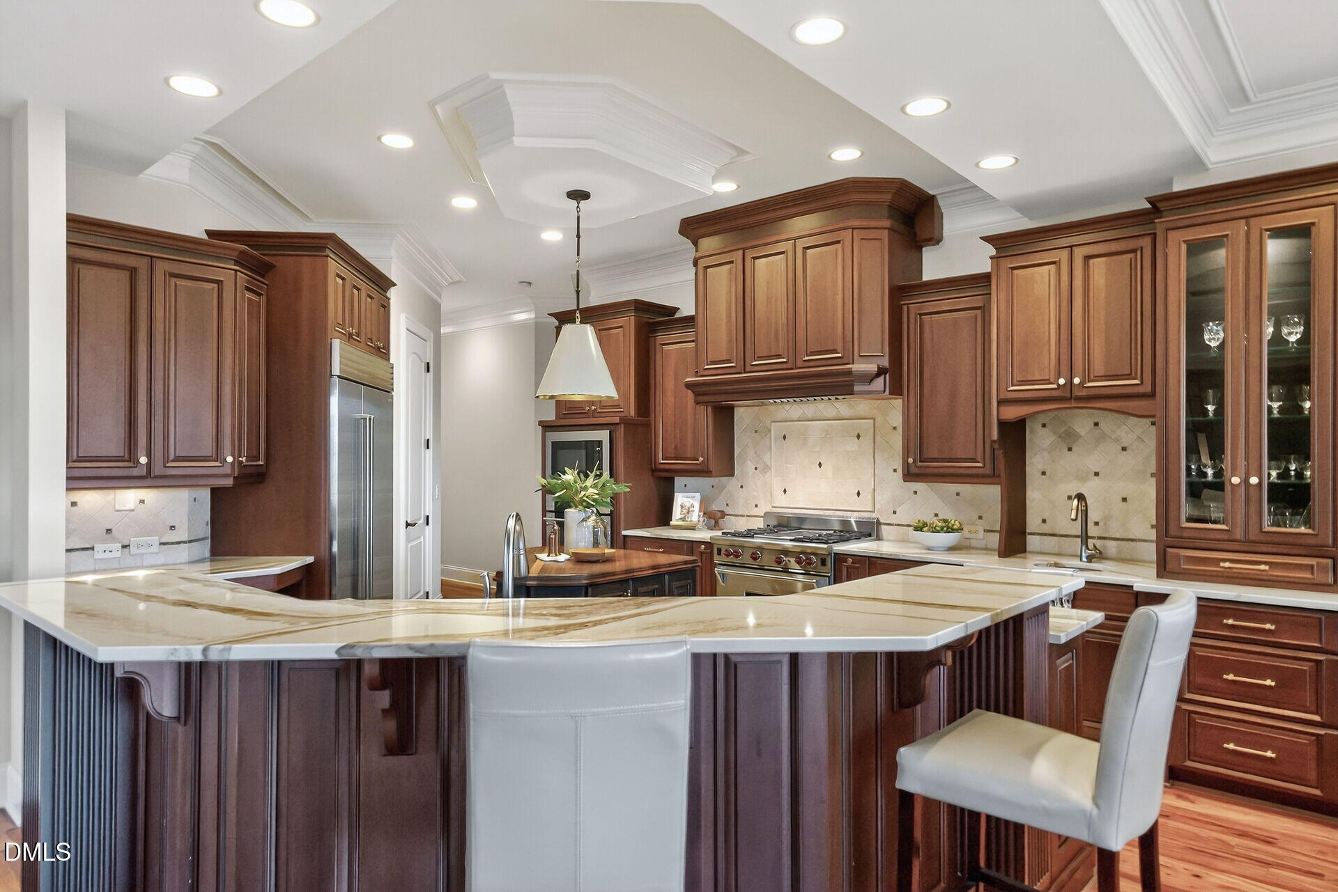 4119 English Garden Way Raleigh, NC 27612 - Photo 20 of 48 a kitchen with stainless steel appliances granite countertop a sink refrigerator and cabinets