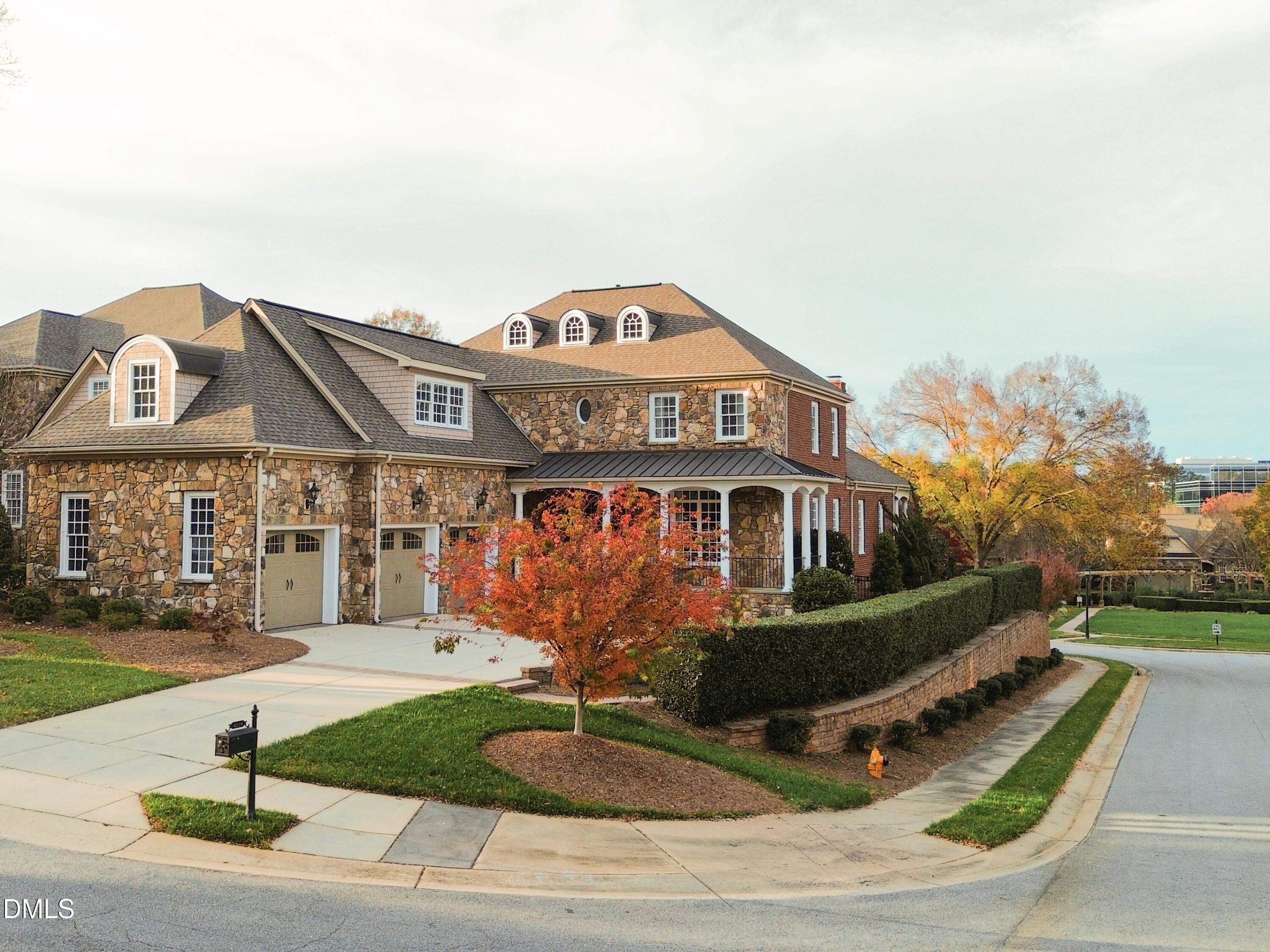 4119 English Garden Way Raleigh, NC 27612 - Photo 2 of 48 a front view of a house with garden