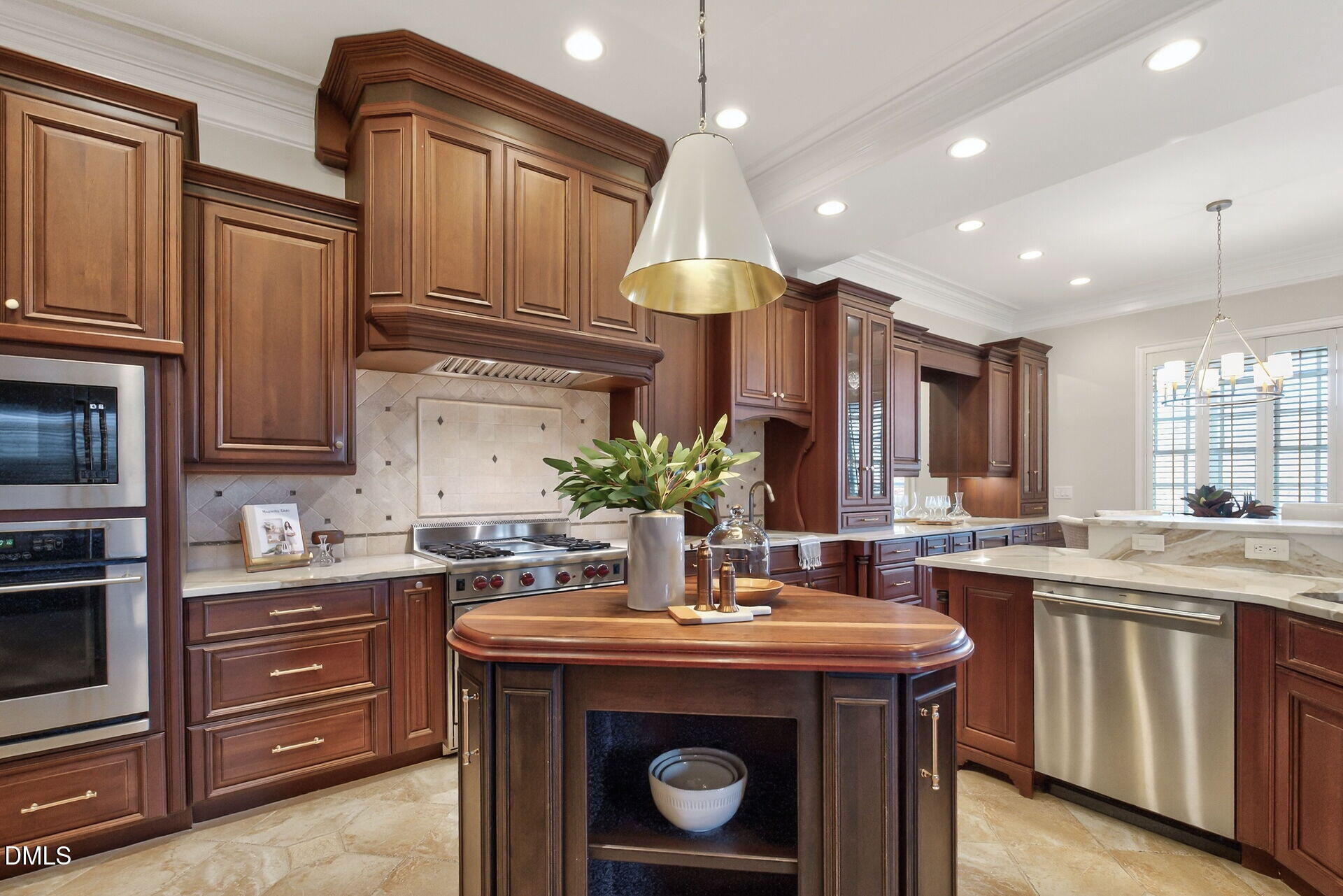 4119 English Garden Way Raleigh, NC 27612 - Photo 23 of 48 a kitchen with kitchen island granite countertop a sink stove and cabinets