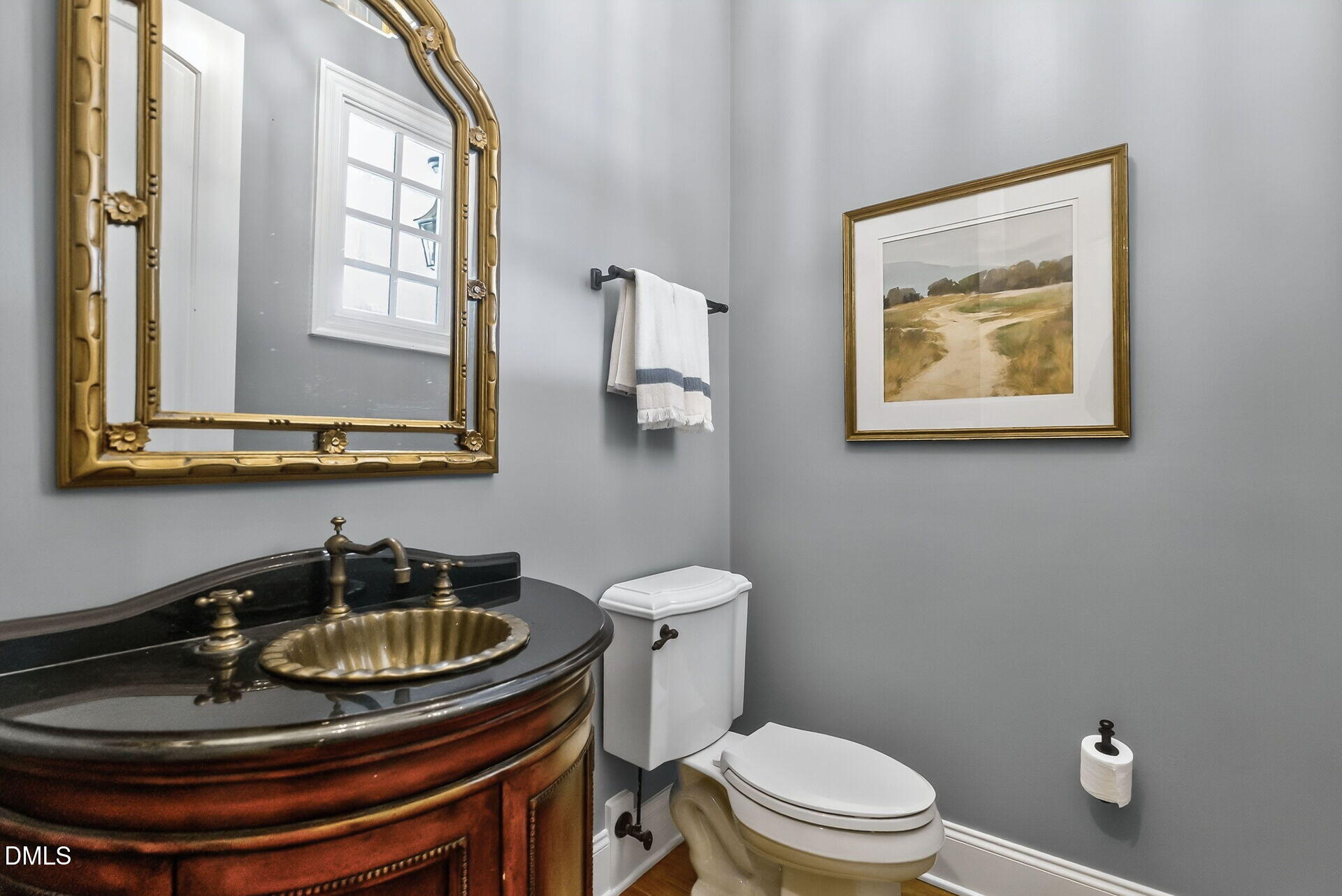 4119 English Garden Way Raleigh, NC 27612 - Photo 24 of 48 a bathroom with a toilet and a sink