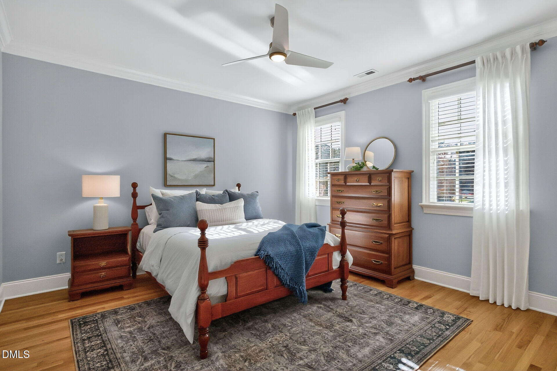 4119 English Garden Way Raleigh, NC 27612 - Photo 33 of 48 a bedroom with a bed and wooden floor