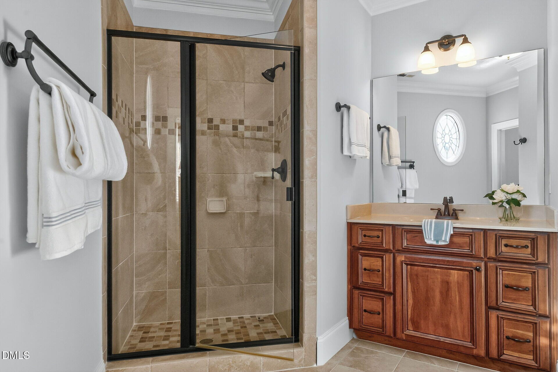 4119 English Garden Way Raleigh, NC 27612 - Photo 34 of 48 a spacious bathroom with a shower a sink and a mirror