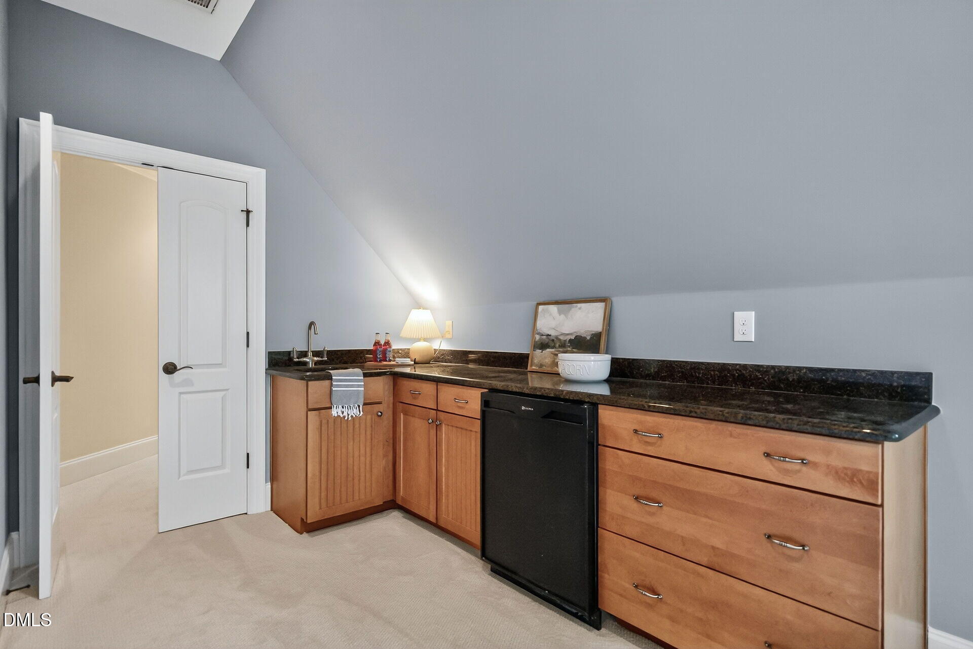 4119 English Garden Way Raleigh, NC 27612 - Photo 39 of 48 a kitchen with granite countertop a sink and cabinets