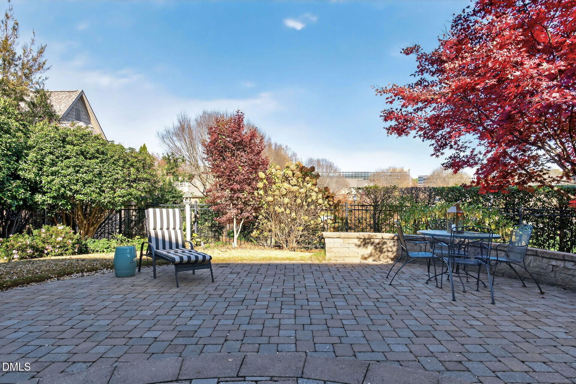 4119 English Garden Way Raleigh, NC 27612 - Photo 45 of 48 a view of a patio with a table and chairs and potted plants