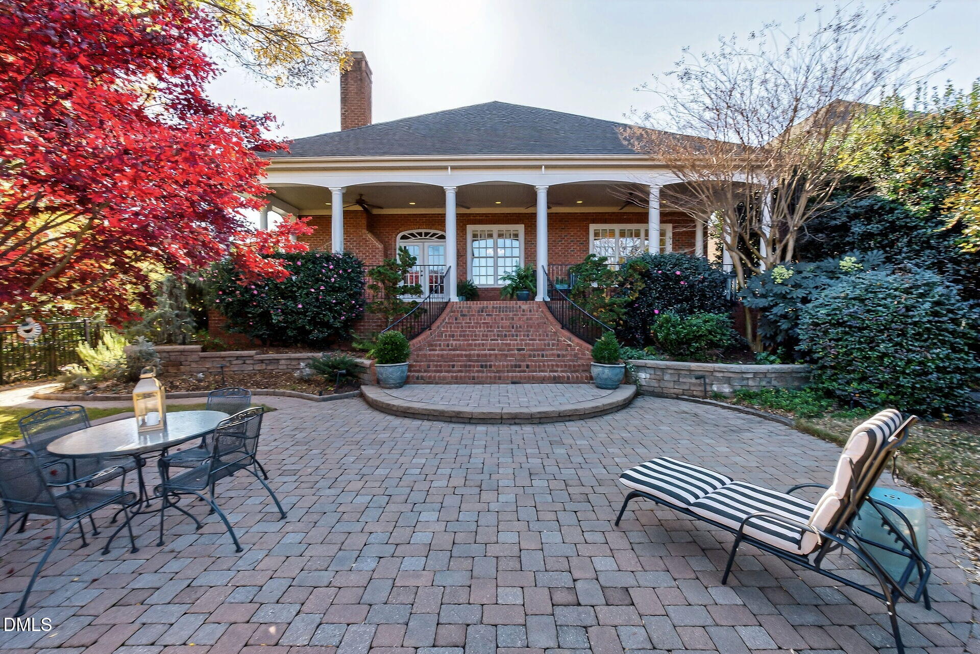 4119 English Garden Way Raleigh, NC 27612 - Photo 47 of 48 a view of a patio with table and chairs and potted plants