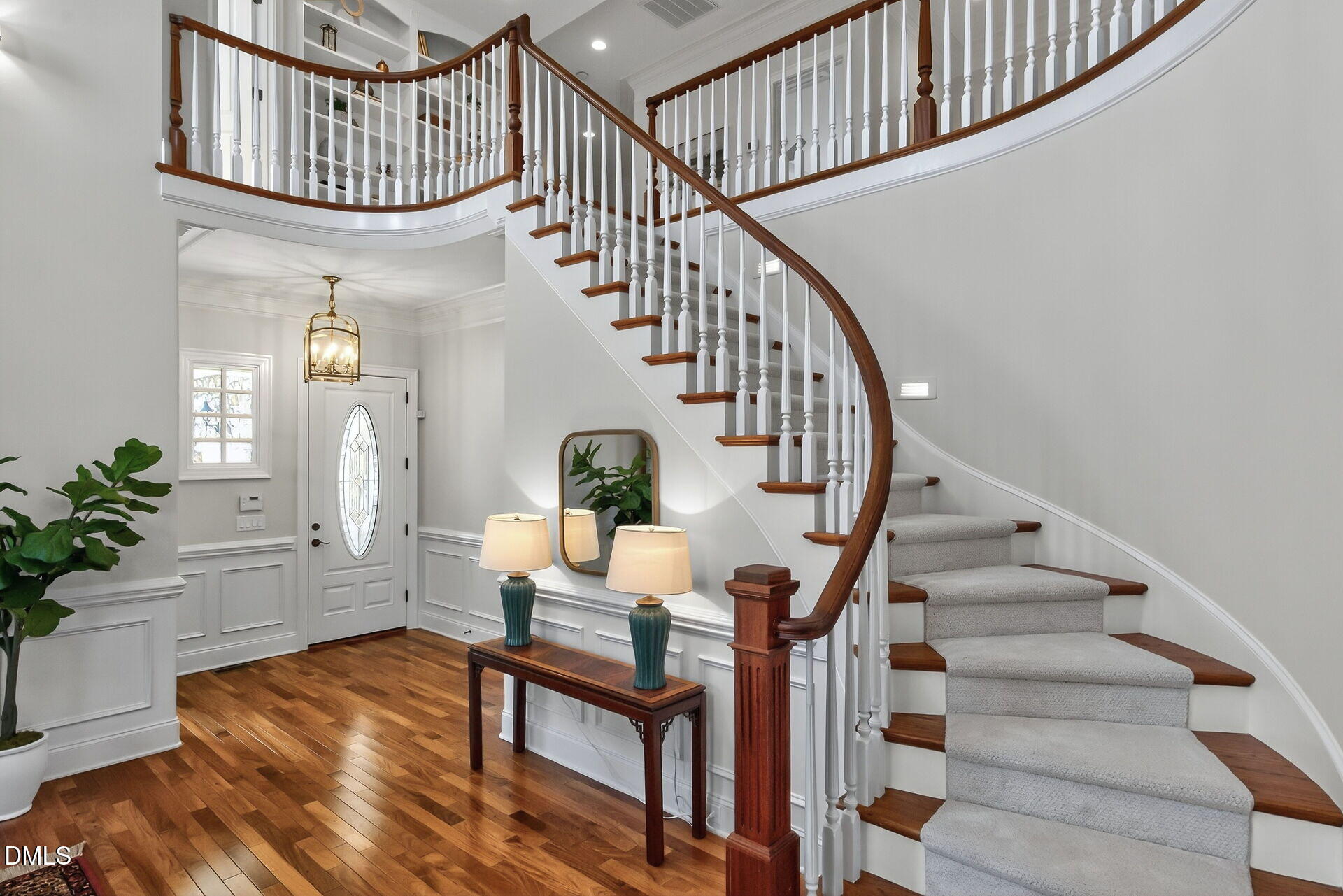 4119 English Garden Way Raleigh, NC 27612 - Photo 6 of 48 a view of entryway livingroom and hall with wooden floor