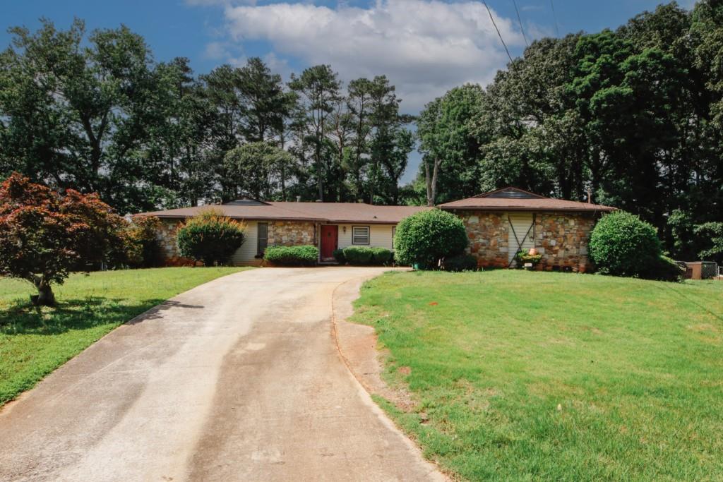 3257 Georgian Woods Circle Decatur, GA 30034 - Photo 1 of 1 a front view of a house with yard and green space