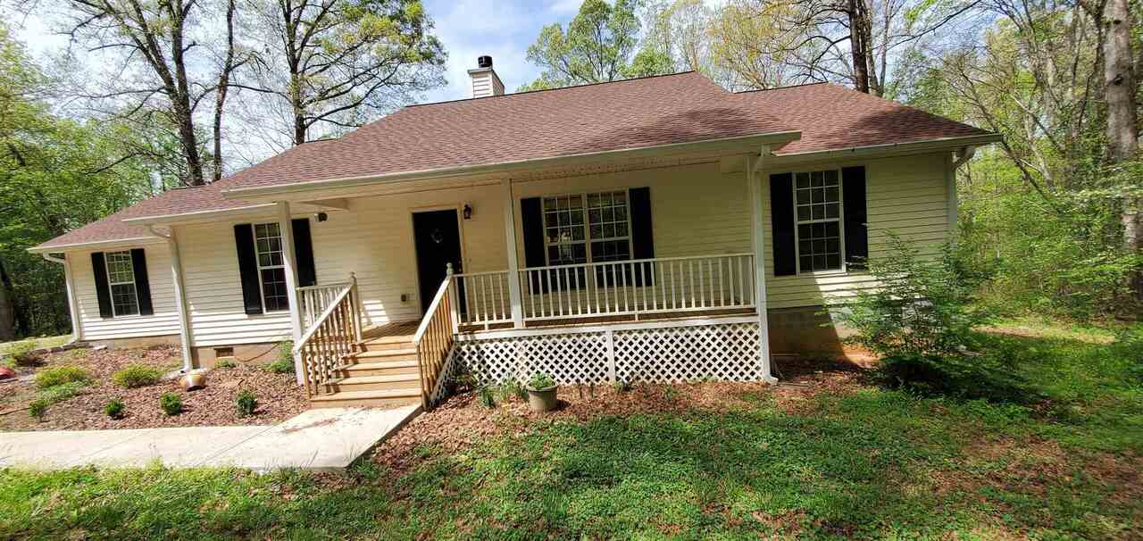 4129 Pond Fork Church Road Pendergrass, GA 30567 - Photo 1 of 1 a front view of a house with garden