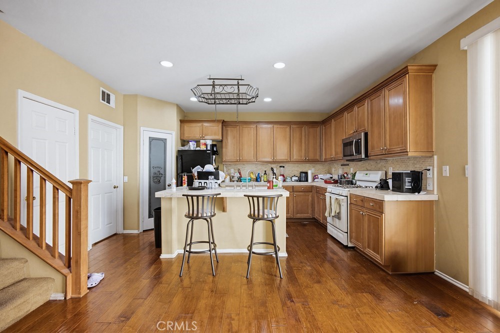 1747 Palermo Drive Riverside, CA 92507 - Photo 8 of 30 a kitchen with a sink cabinets and wooden floor