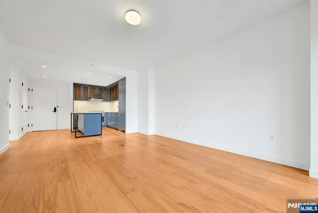 a view of empty room with a fireplace