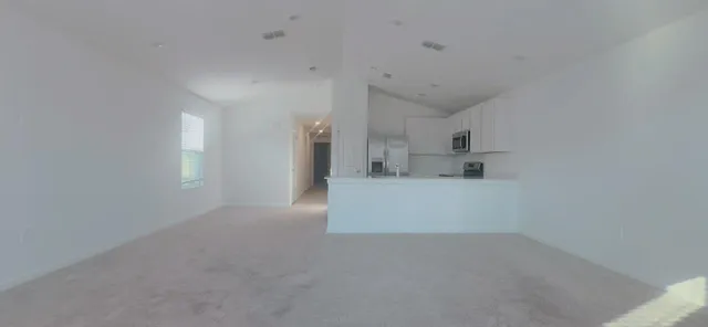 a view of a kitchen with a sink