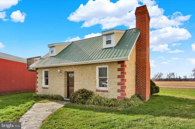a view of a lake and houses in the back