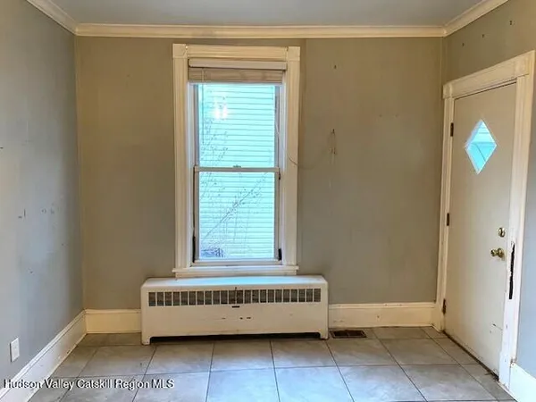 a view of room with window and stairs