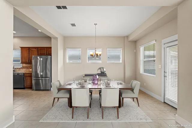a dining room with furniture and window